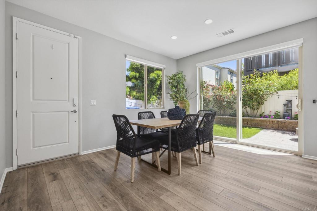 1167 Via Lucero Oceanside, CA 92056 - Photo 6 of 54 a view of a dining room with furniture window and wooden floor