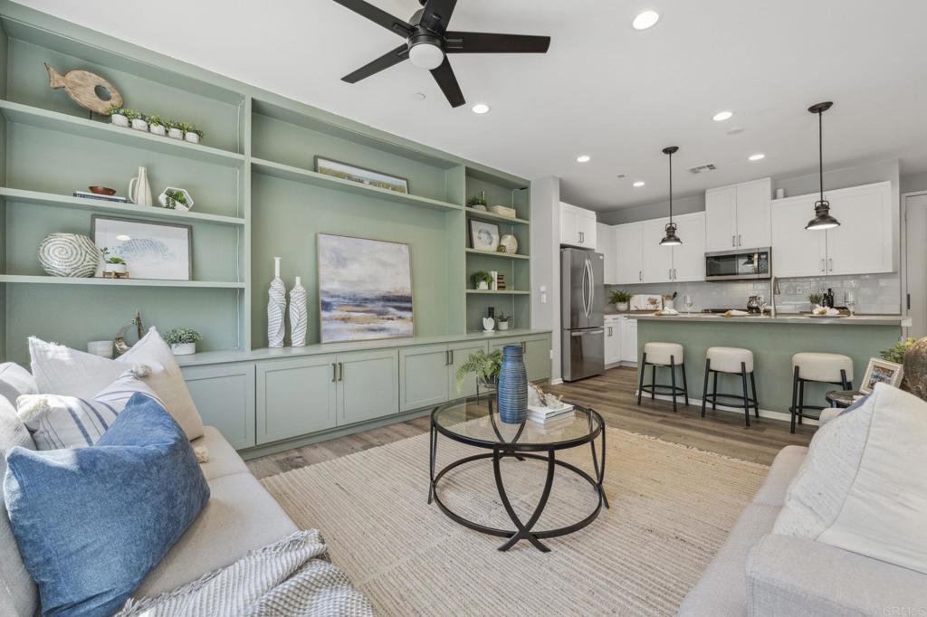 1167 Via Lucero Oceanside, CA 92056 - Photo 8 of 54 a living room with furniture and a wooden floor