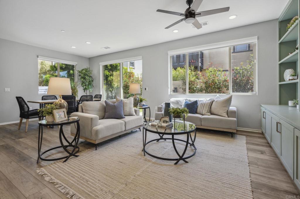 1167 Via Lucero Oceanside, CA 92056 - Photo 9 of 54 a living room with furniture and a large window