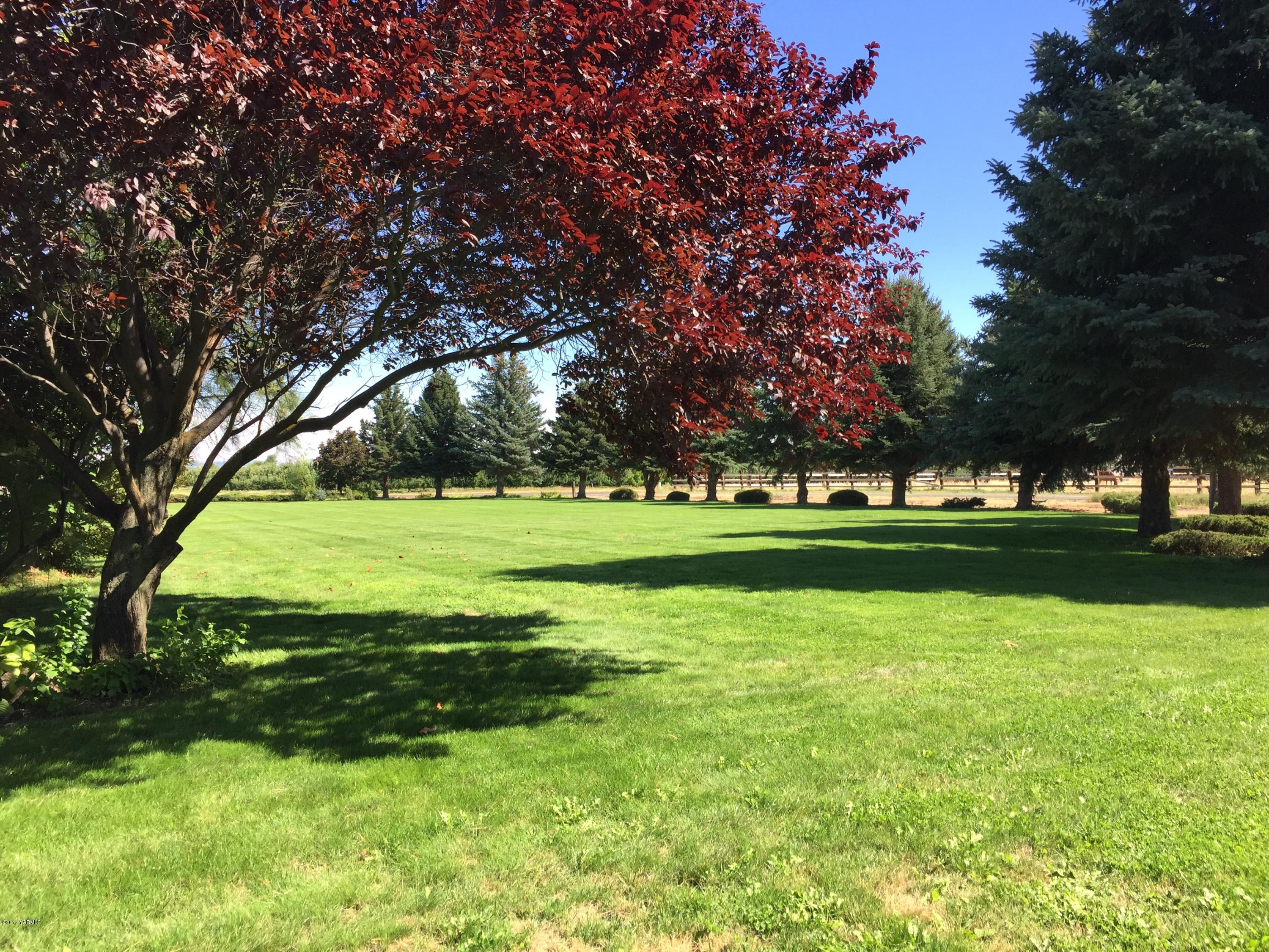 804 Estes Road Yakima, WA 98908 - Photo 6 of 18 a view of a golf course with a lake