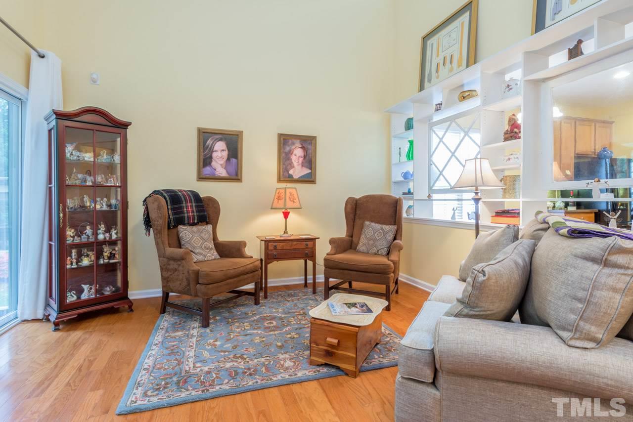 3406 Cathedral Bell Road Raleigh, NC 27614 - Photo 11 of 25 a living room with furniture and wooden floor