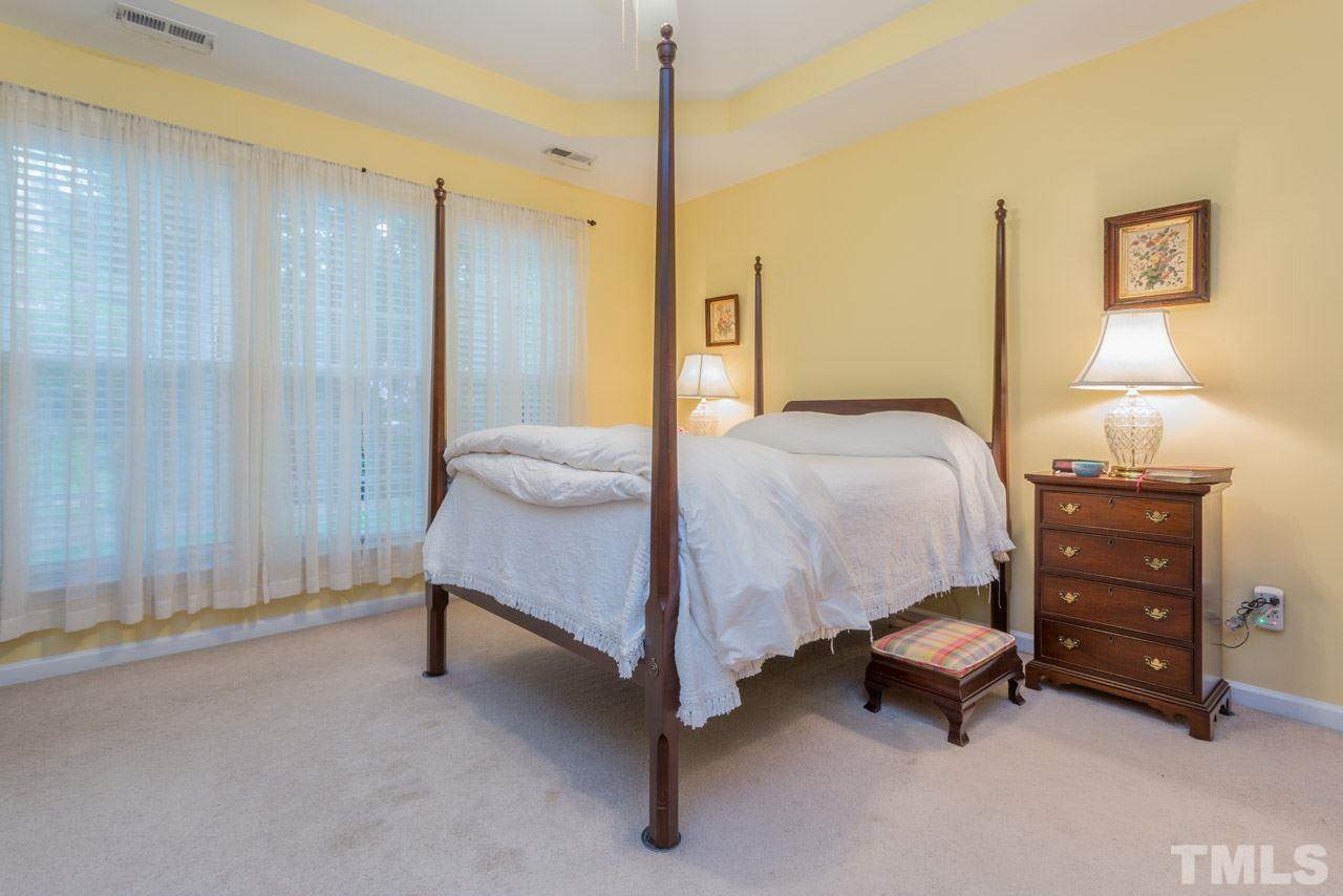 3406 Cathedral Bell Road Raleigh, NC 27614 - Photo 12 of 25 a bedroom with a bed and a table