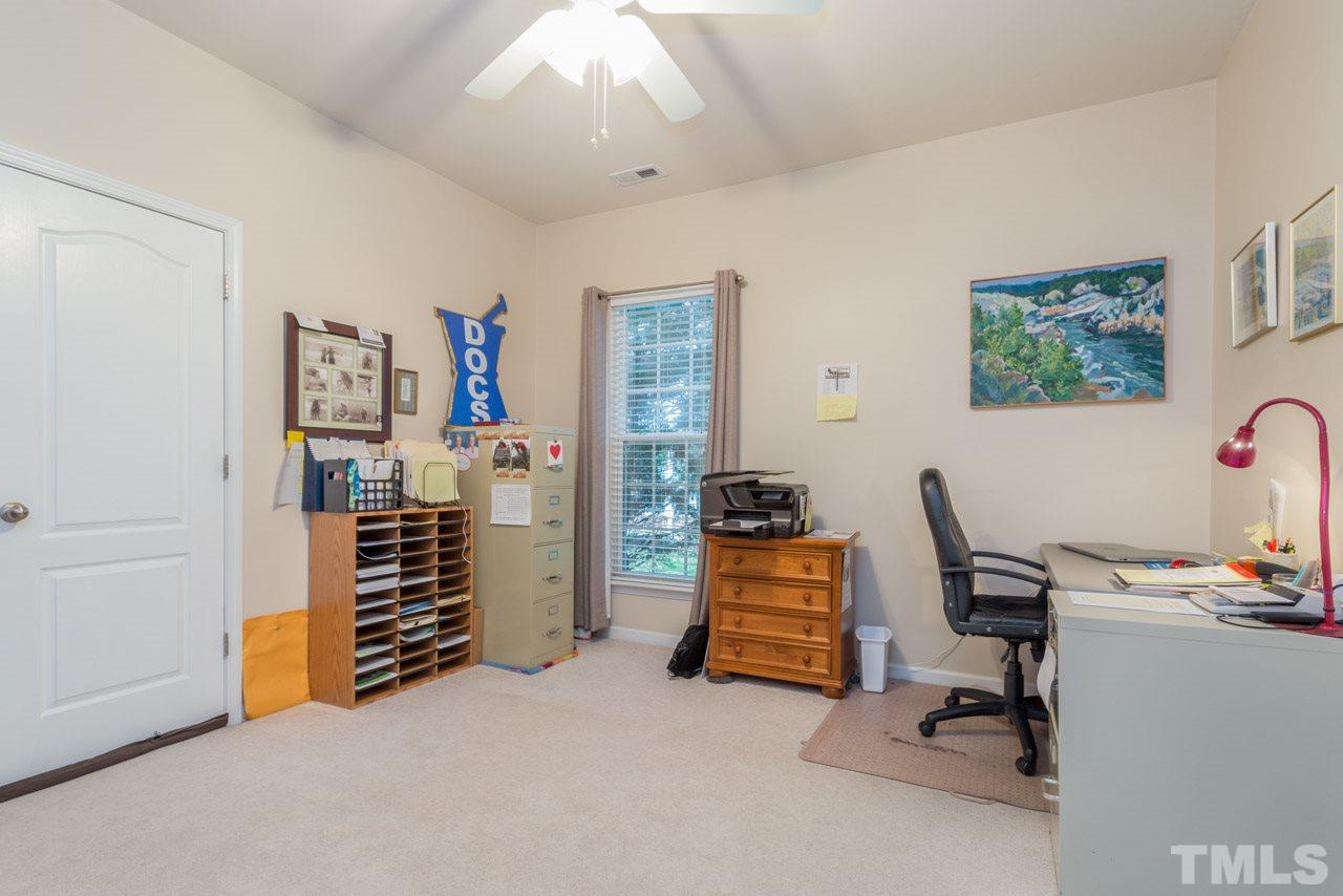 3406 Cathedral Bell Road Raleigh, NC 27614 - Photo 15 of 25 a view of a workspace with furniture and a window