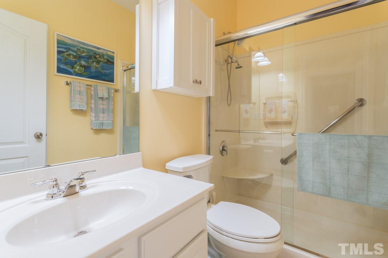 3406 Cathedral Bell Road Raleigh, NC 27614 - Photo 16 of 25 a bathroom with a sink a toilet and shower