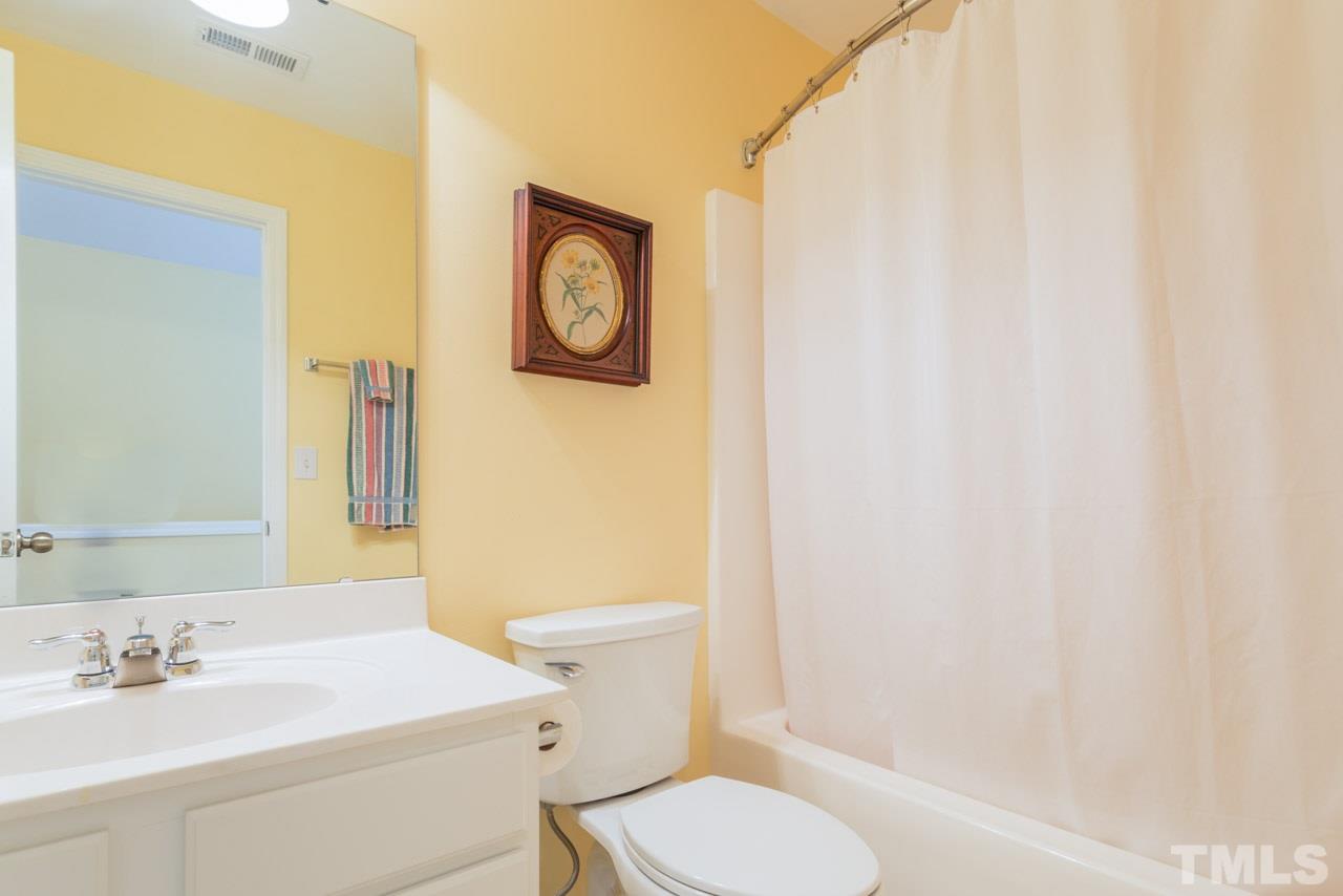 3406 Cathedral Bell Road Raleigh, NC 27614 - Photo 19 of 25 a bathroom with a sink and a mirror