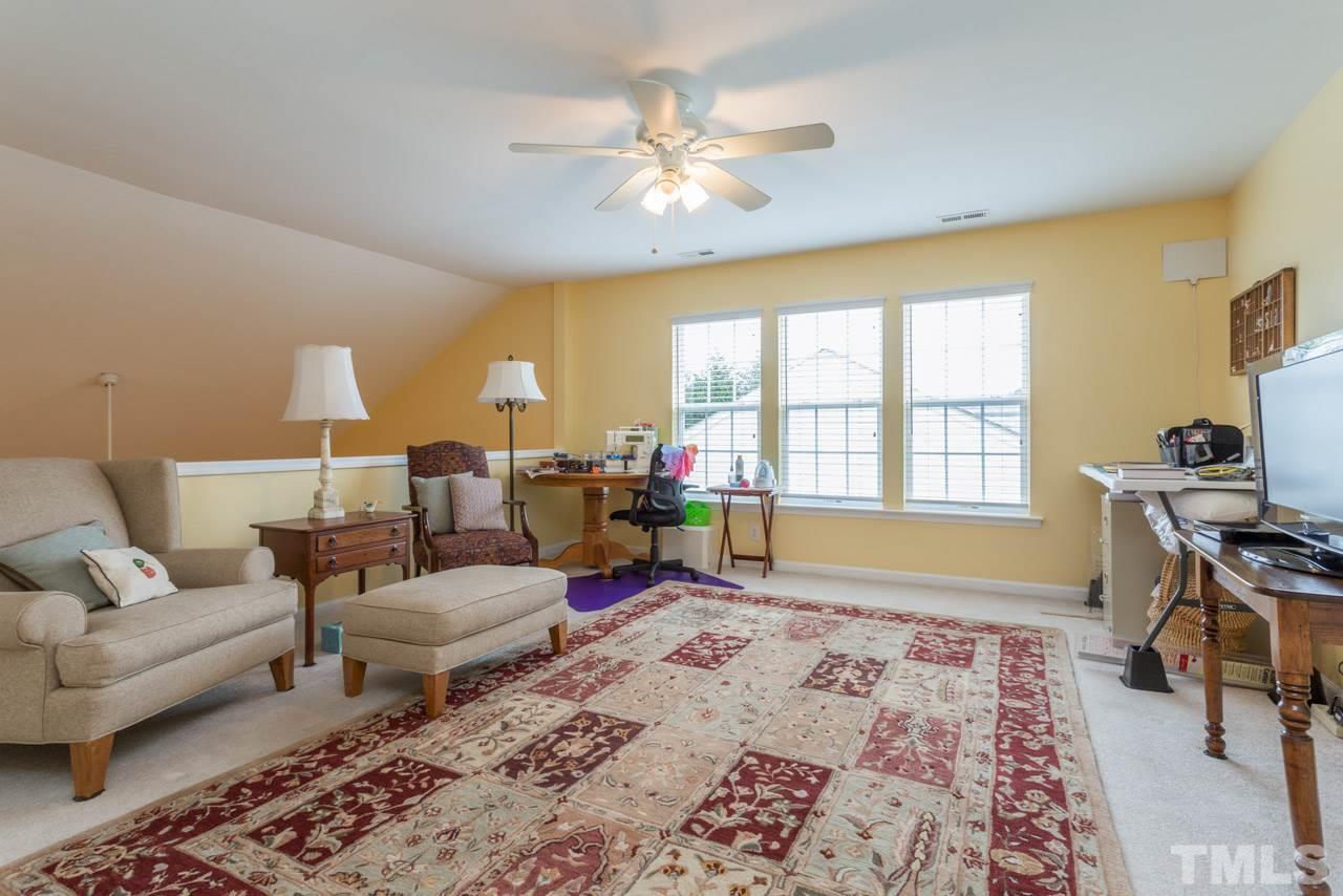 3406 Cathedral Bell Road Raleigh, NC 27614 - Photo 21 of 25 a living room with furniture and a window