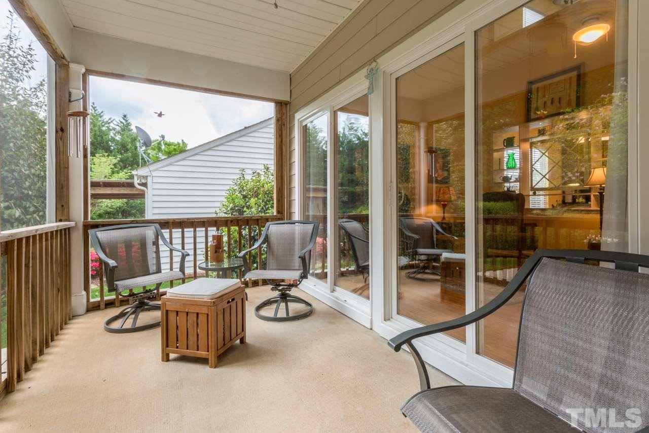 3406 Cathedral Bell Road Raleigh, NC 27614 - Photo 22 of 25 a view of a balcony with chair and table
