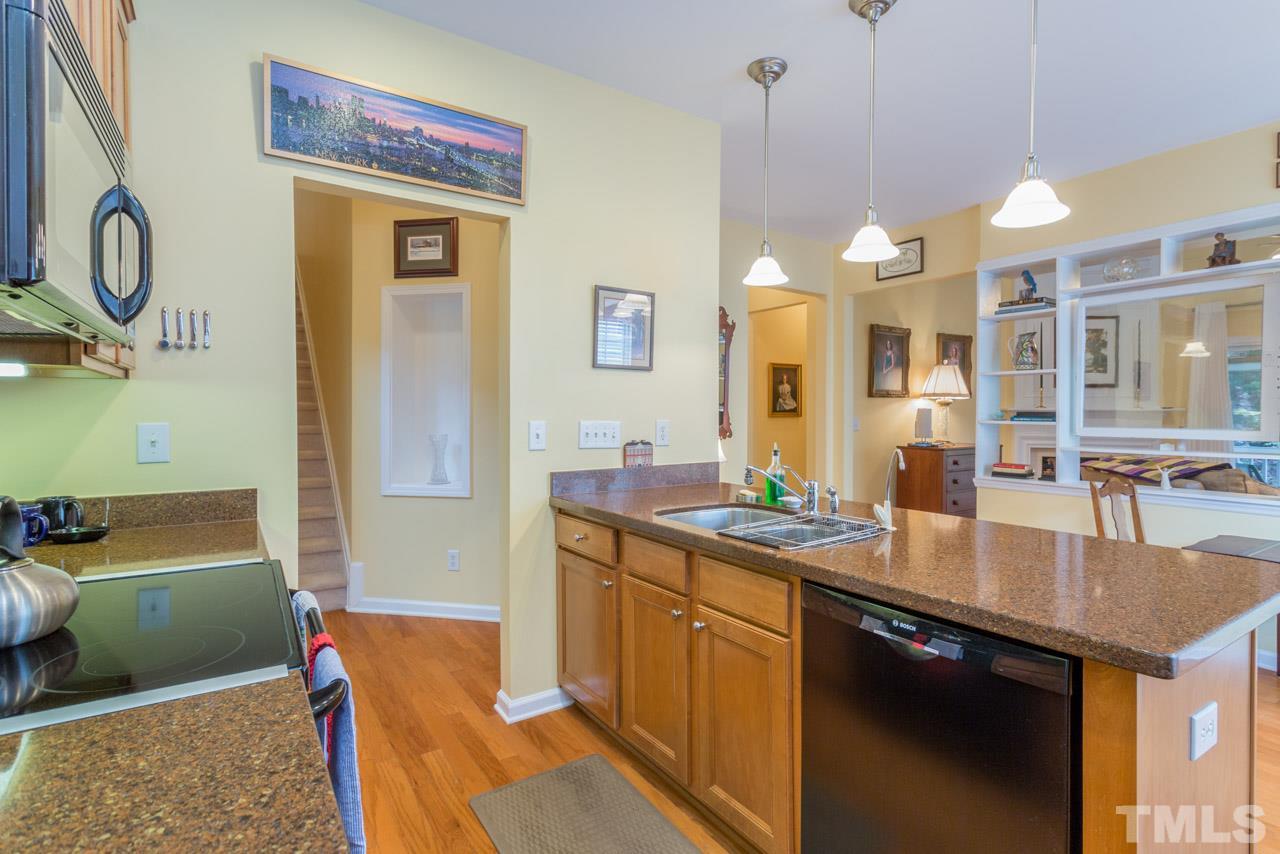 3406 Cathedral Bell Road Raleigh, NC 27614 - Photo 5 of 25 a kitchen with a sink cabinets and window
