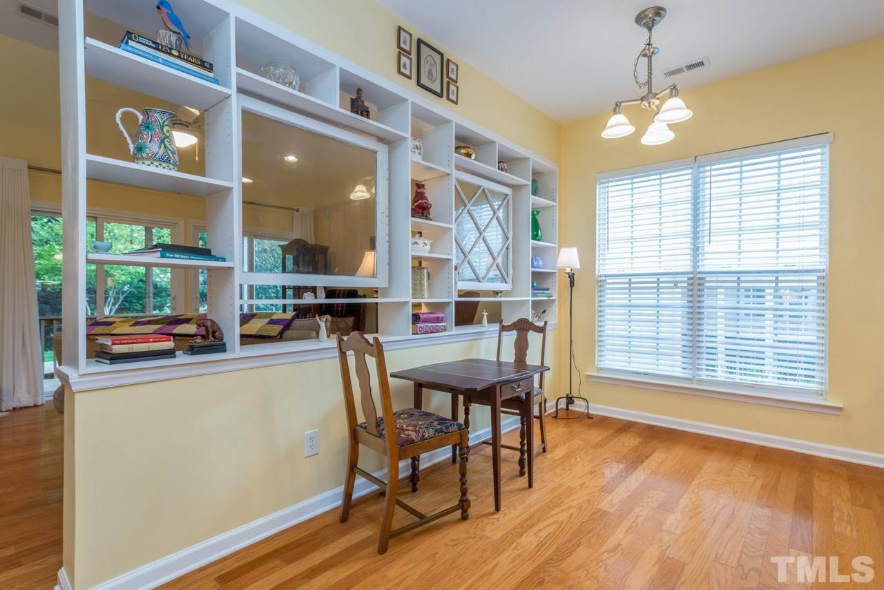 3406 Cathedral Bell Road Raleigh, NC 27614 - Photo 9 of 25 a dining room with furniture window wooden floor