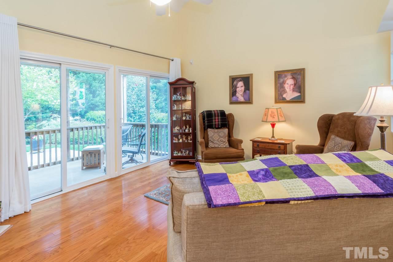 3406 Cathedral Bell Road Raleigh, NC 27614 - Photo 10 of 25 a bedroom with a bed and wooden floor