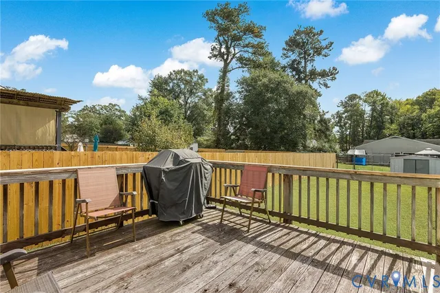 a view of a chair and table on the wooden floor