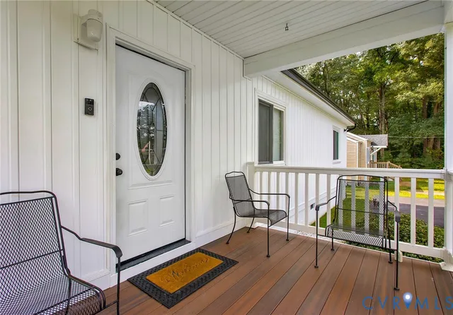 a view of a balcony with furniture