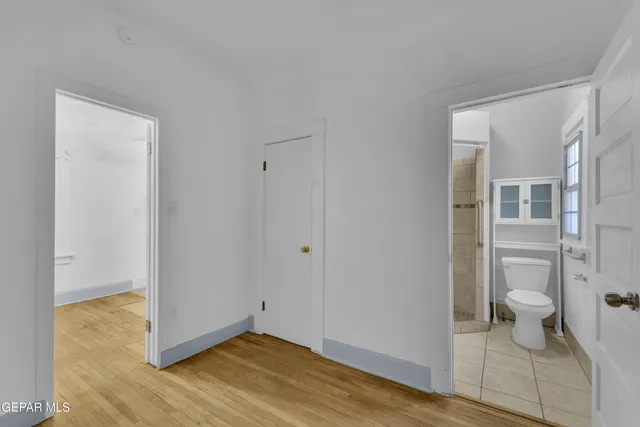 a bathroom with a shower sink and mirror
