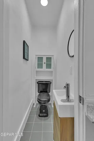 a view of a hallway with wooden floor and closet
