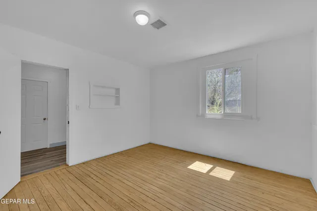 a view of a patio with table and chairs