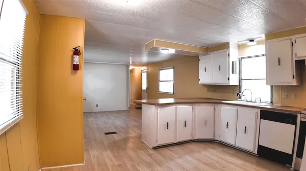a kitchen with stainless steel appliances a refrigerator and a stove top oven