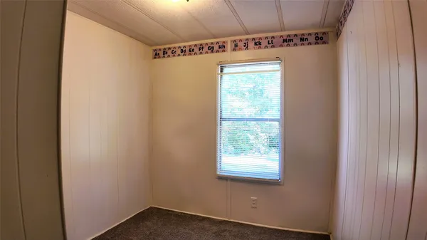 a view of walk in closet with a mirror