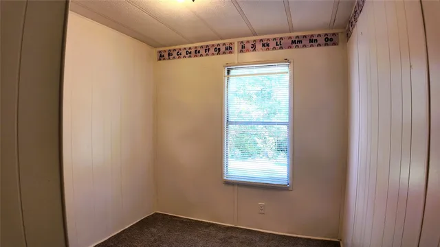 a view of walk in closet with a mirror
