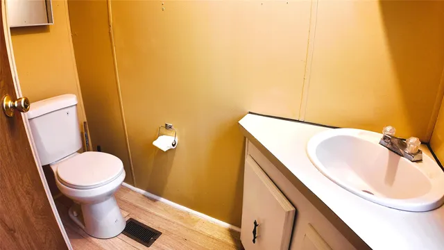 a view of hallway with wooden floor