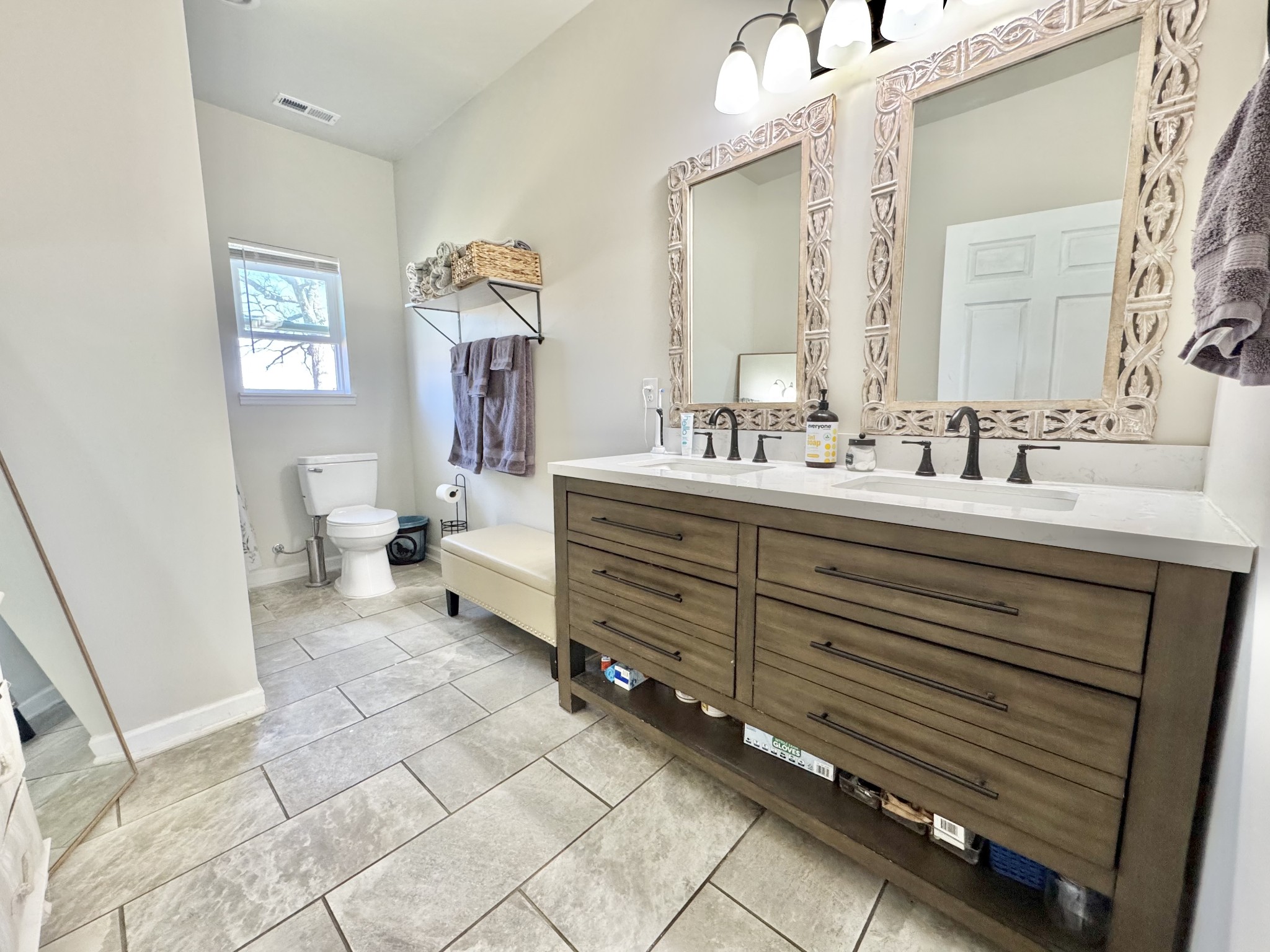 11250 Shelbyville Road Morrison, TN 37357 - Photo 28 of 33 a en suite bathroom with a double vanity sink a mirror and a toilet