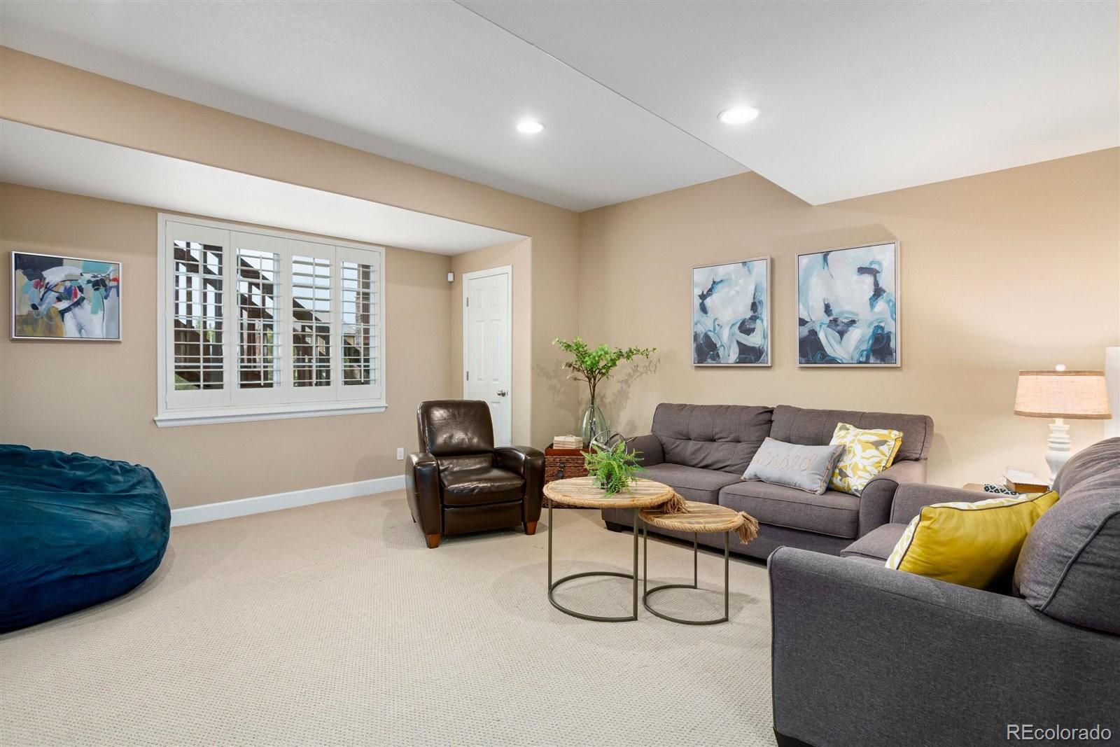 690 Tiger Lily Way Highlands Ranch, CO 80126 - Photo 25 of 38 a living room with furniture and a window