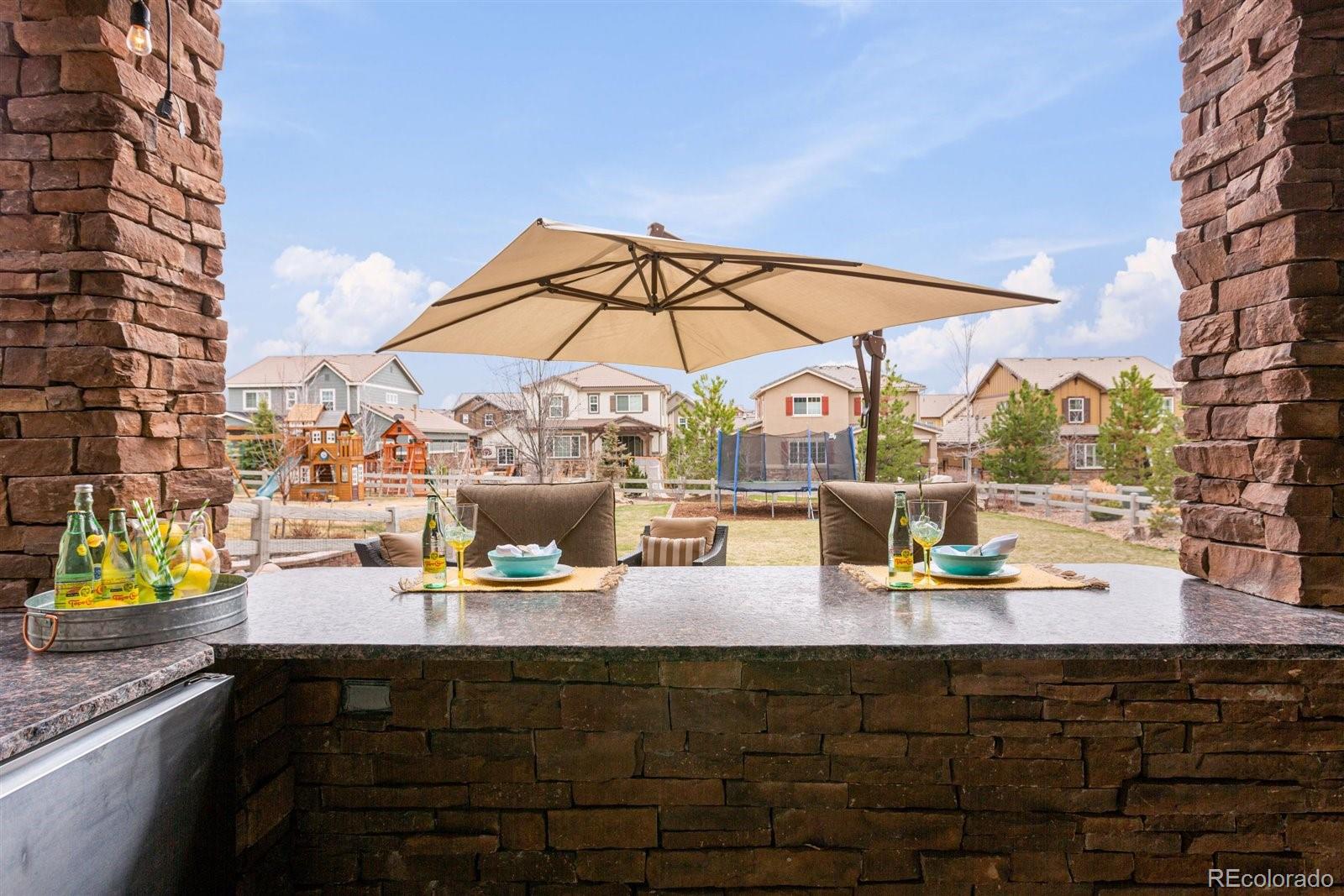690 Tiger Lily Way Highlands Ranch, CO 80126 - Photo 32 of 38 a view of an outdoor seating area