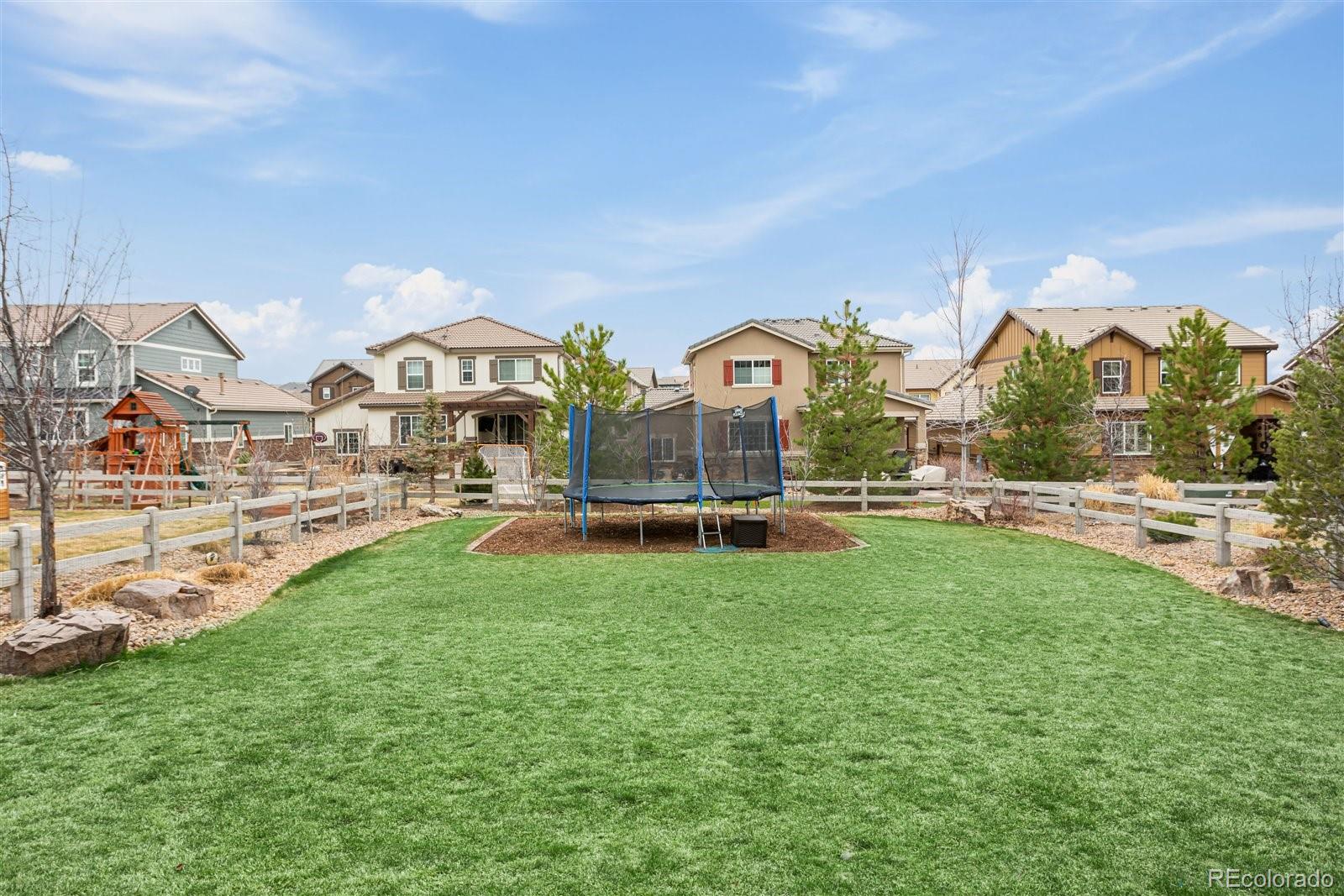 690 Tiger Lily Way Highlands Ranch, CO 80126 - Photo 36 of 38 a view of a park with large trees