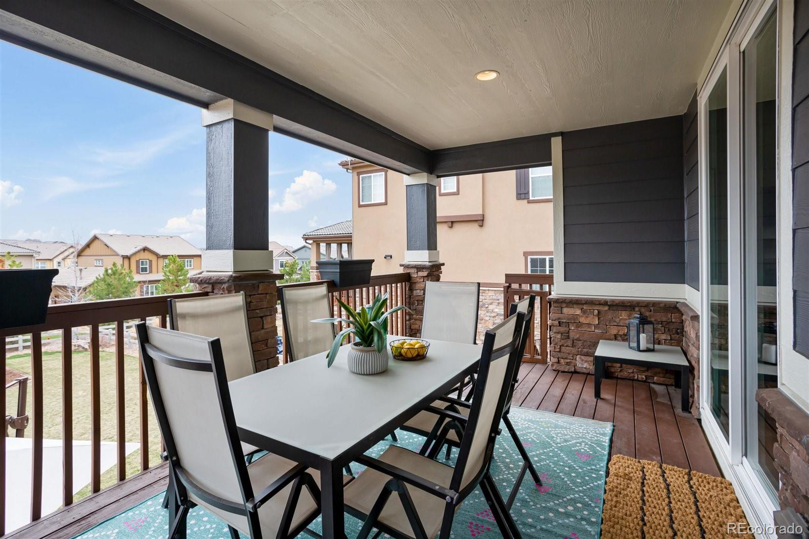 690 Tiger Lily Way Highlands Ranch, CO 80126 - Photo 38 of 38 a dining room with furniture window and wooden floor