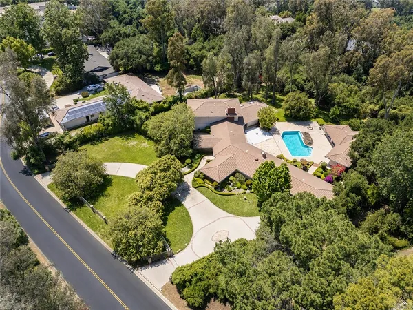 an aerial view of a house with a garden