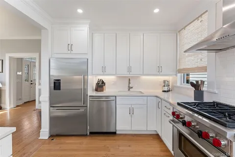 a kitchen with a stove and a refrigerator