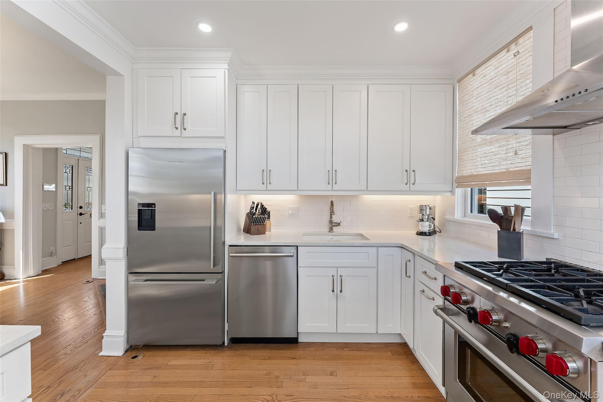 25 Merriam Avenue Bronxville, NY 10708 - Photo 9 of 26 a kitchen with a stove and a refrigerator