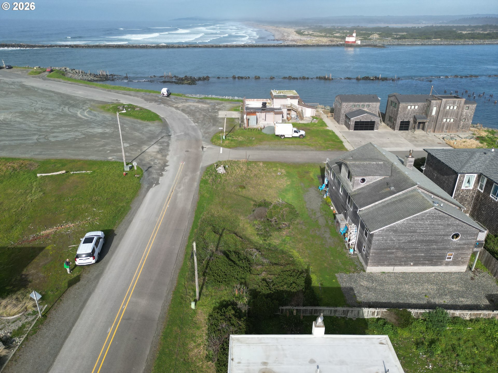 Secorner Lincoln 3rd Street Southwest Bandon, OR 97411 - Photo 3 of 10 a view of swimming pool with outdoor seating and yard