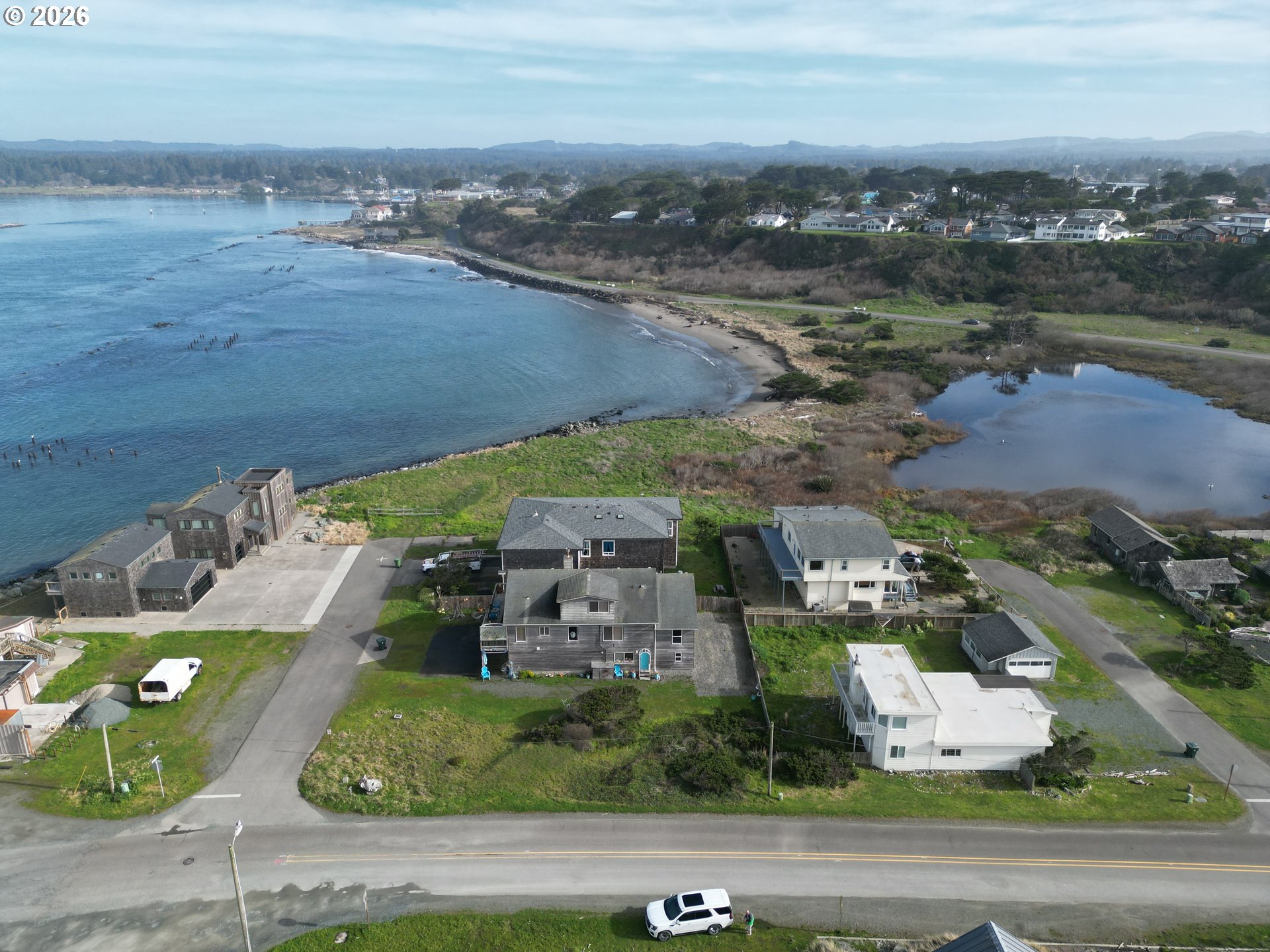 Secorner Lincoln 3rd Street Southwest Bandon, OR 97411 - Photo 5 of 10 an aerial view of residential houses with outdoor space