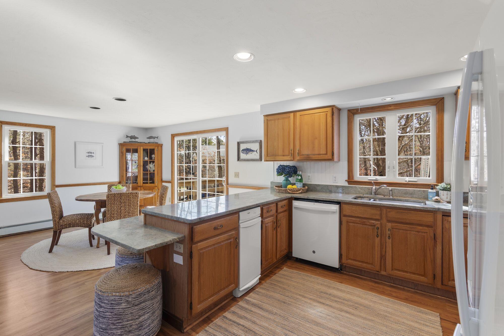 263 Spruce Road Harwich, MA 02645 - Photo 13 of 53 a large kitchen with kitchen island a large island in the center