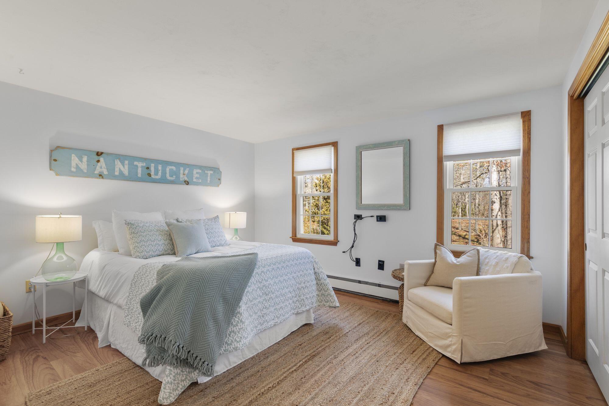 263 Spruce Road Harwich, MA 02645 - Photo 16 of 53 a spacious bedroom with a bed and a couch