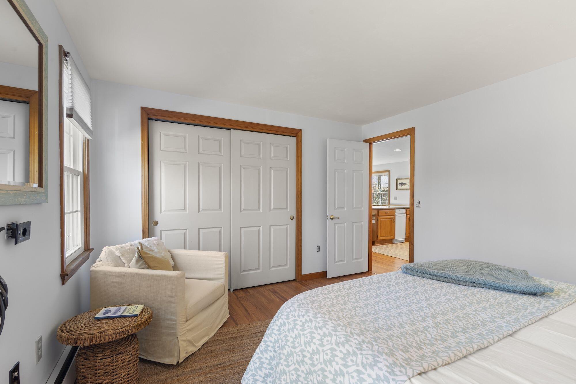 263 Spruce Road Harwich, MA 02645 - Photo 18 of 53 a bedroom with a bed and wooden floor