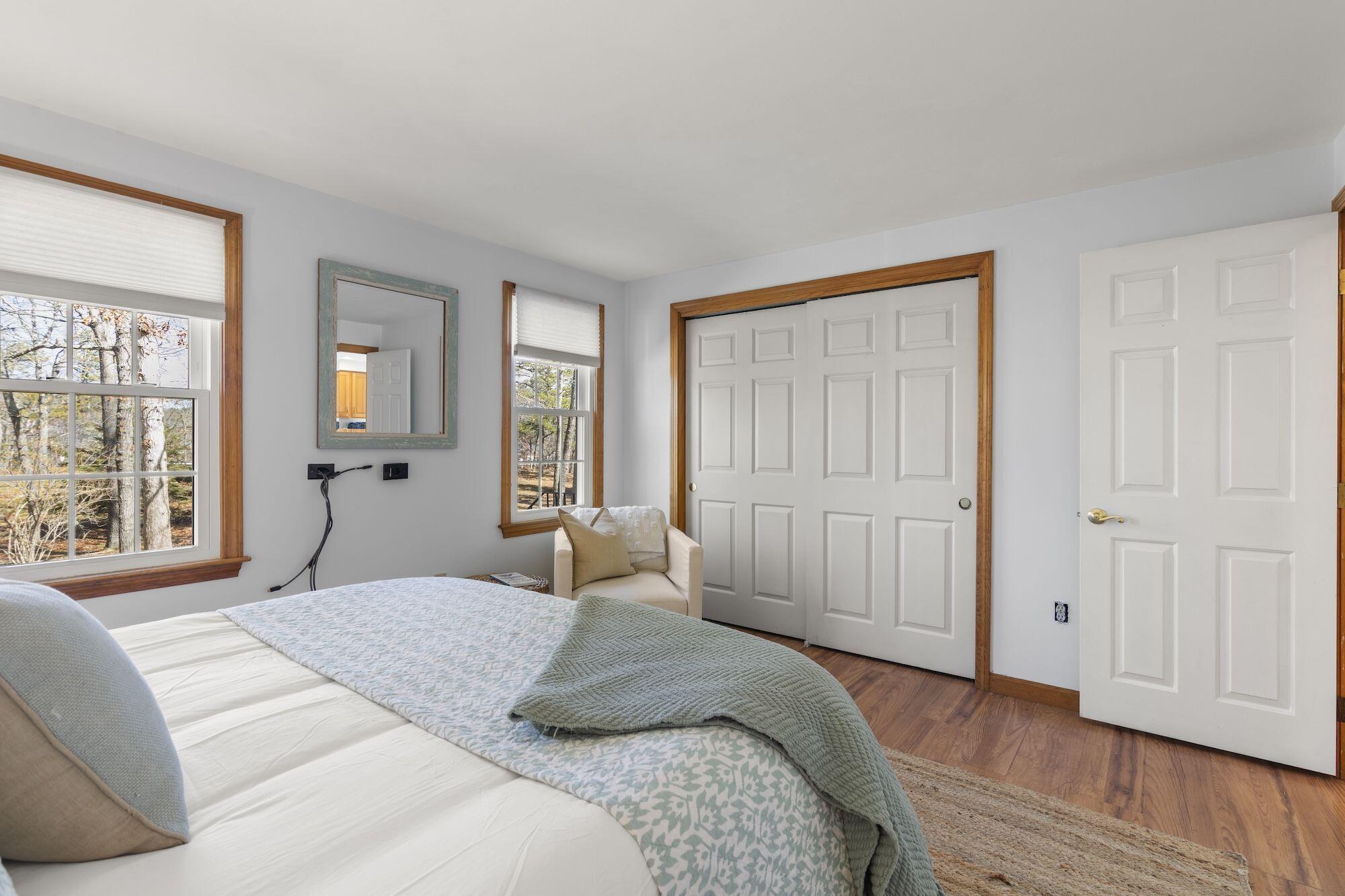 263 Spruce Road Harwich, MA 02645 - Photo 19 of 53 a bedroom with a large bed and a window