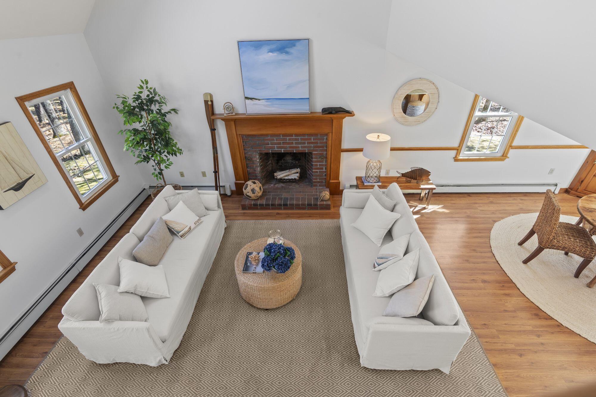 263 Spruce Road Harwich, MA 02645 - Photo 22 of 53 a living room with furniture and a fireplace