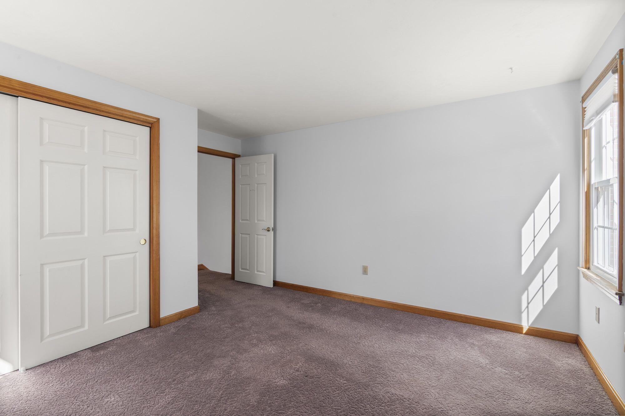 263 Spruce Road Harwich, MA 02645 - Photo 24 of 53 a view of an empty room with a window