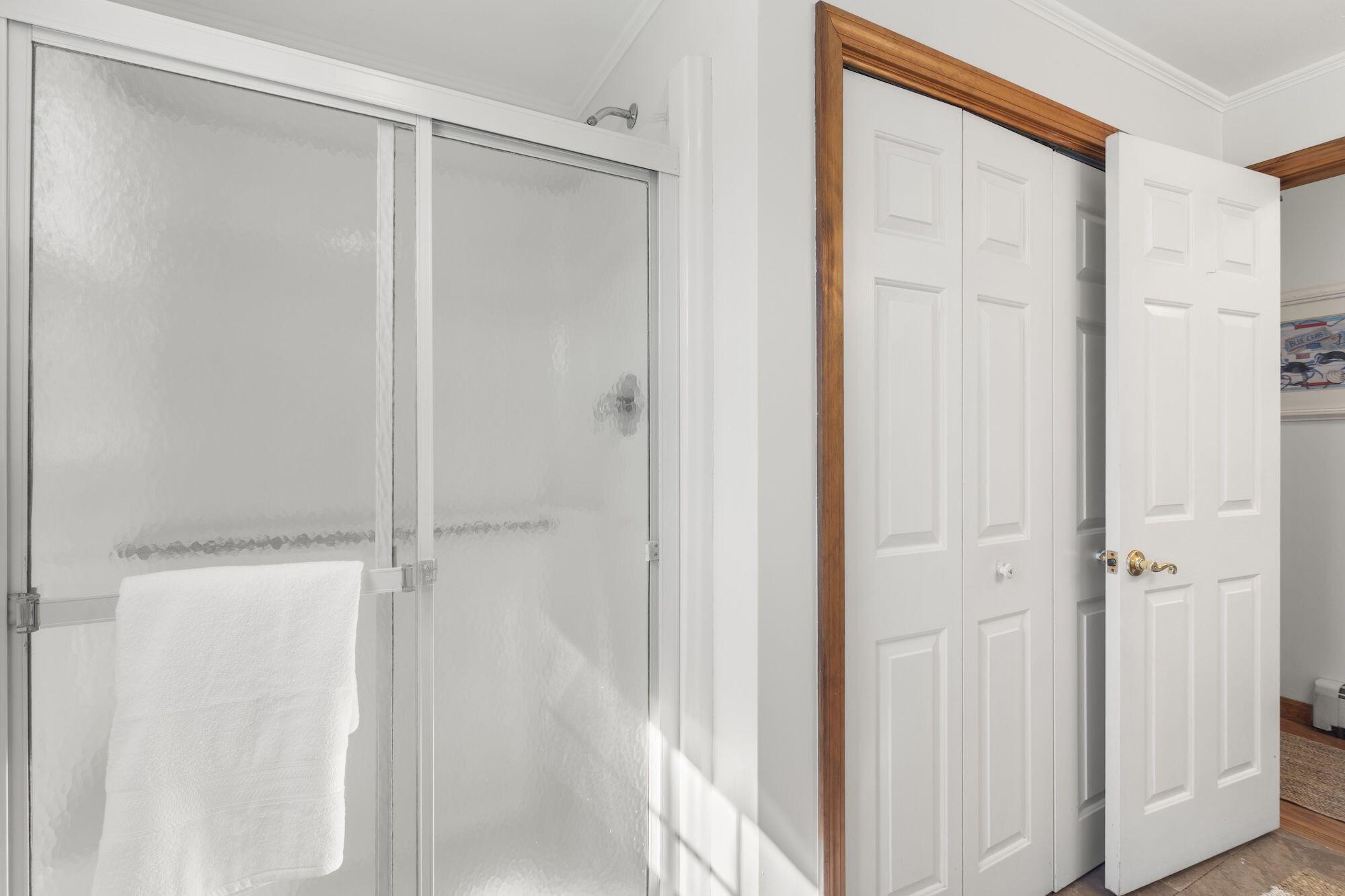 263 Spruce Road Harwich, MA 02645 - Photo 28 of 53 a bathroom with a glass shower door