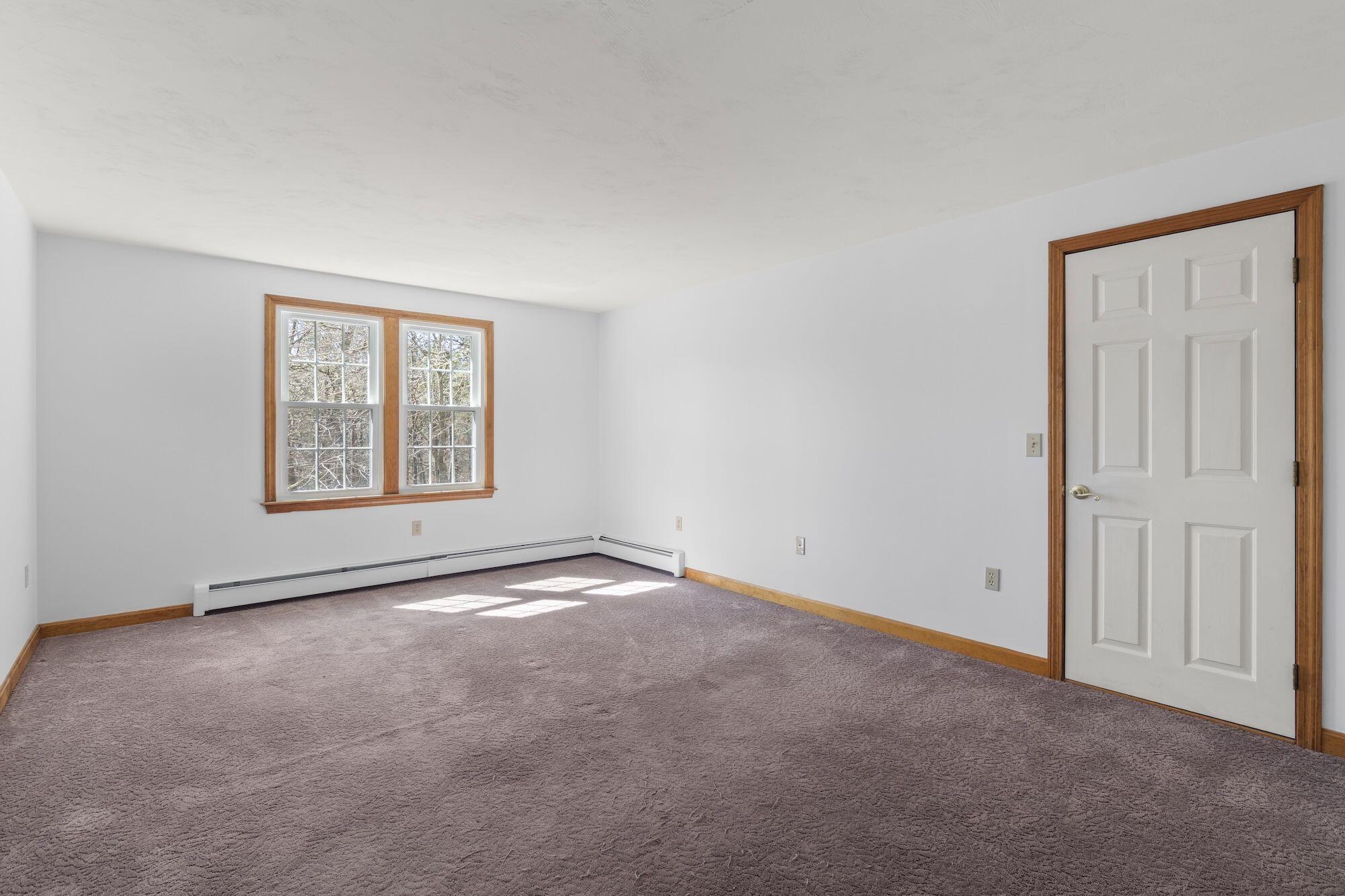 263 Spruce Road Harwich, MA 02645 - Photo 29 of 53 an empty room with windows and closet