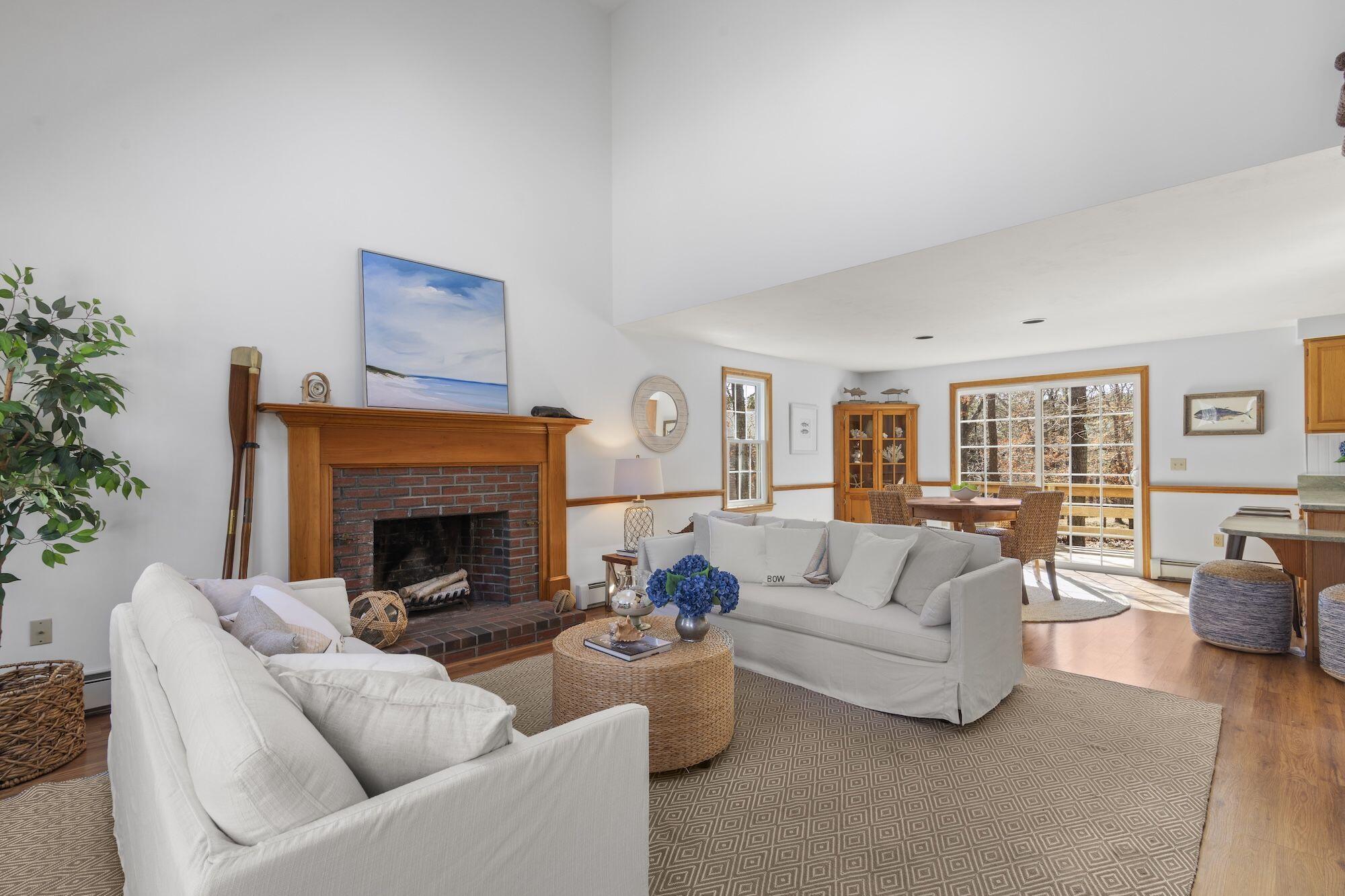 263 Spruce Road Harwich, MA 02645 - Photo 3 of 53 a living room with furniture and a fireplace