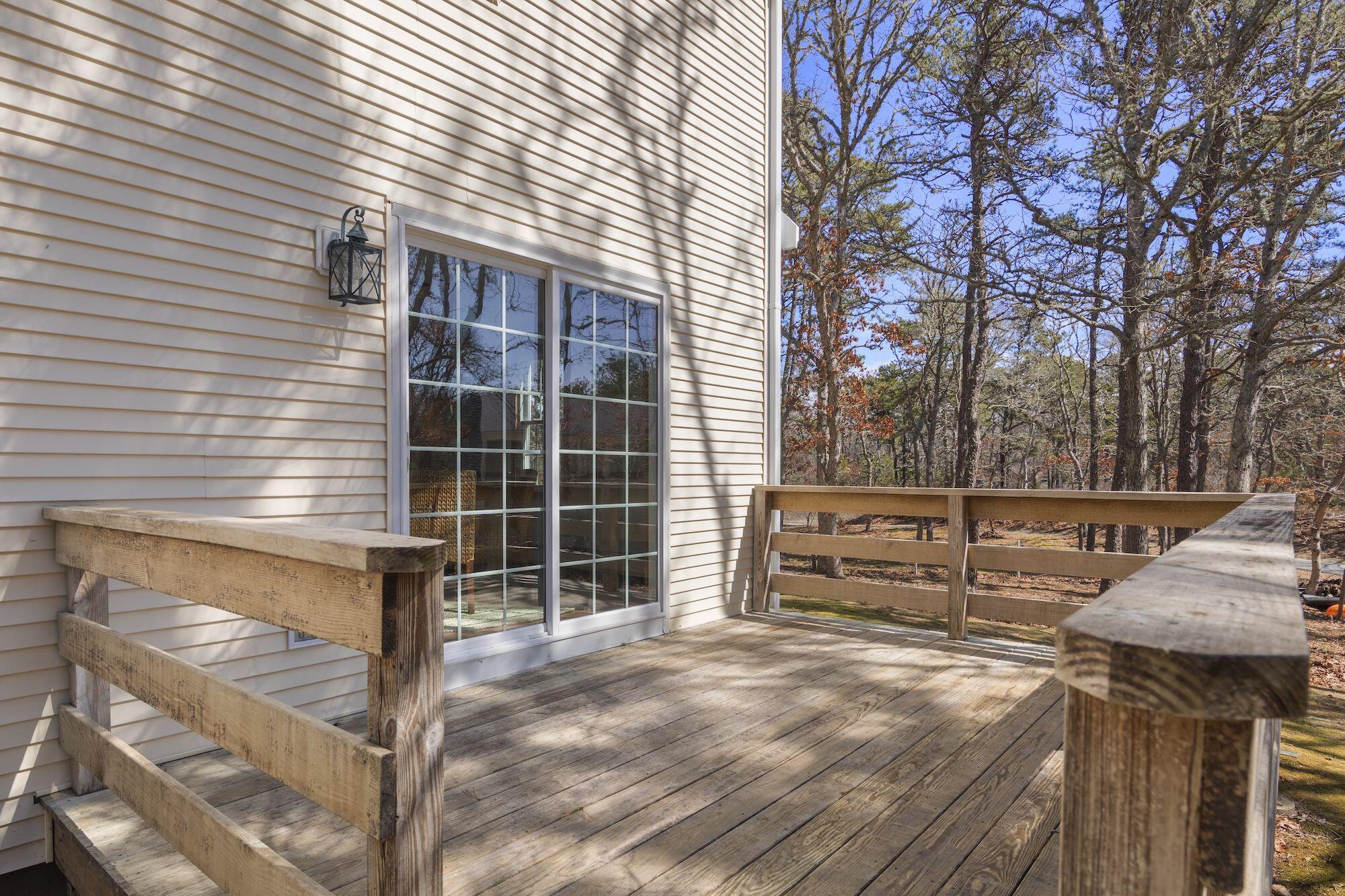 263 Spruce Road Harwich, MA 02645 - Photo 35 of 53 a view of a backyard and trees