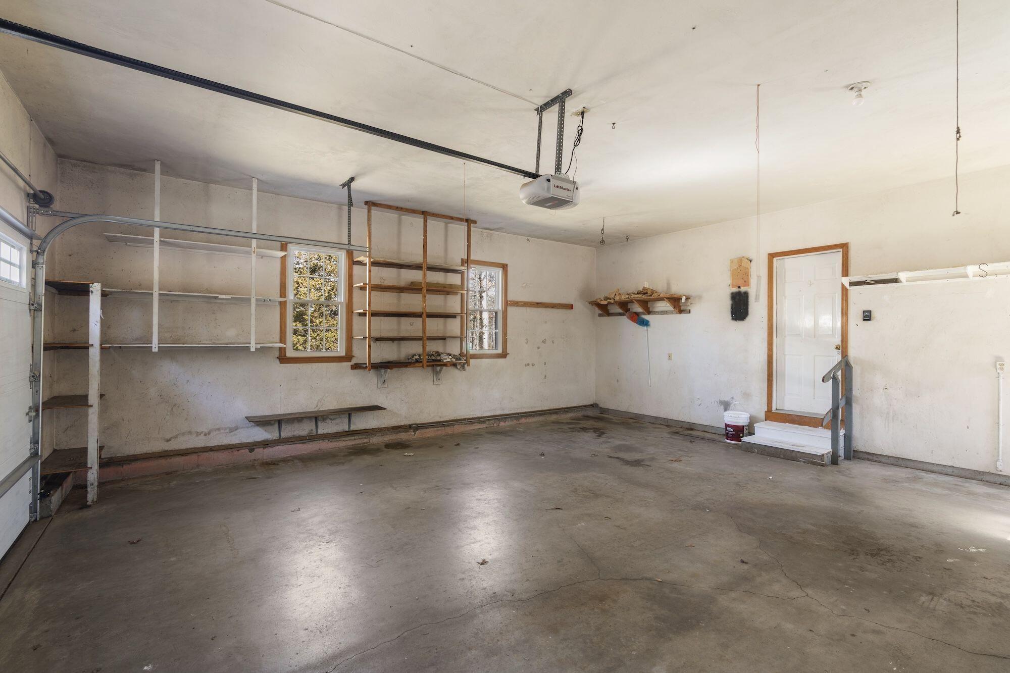 263 Spruce Road Harwich, MA 02645 - Photo 38 of 53 an empty room with wooden shelves and windows