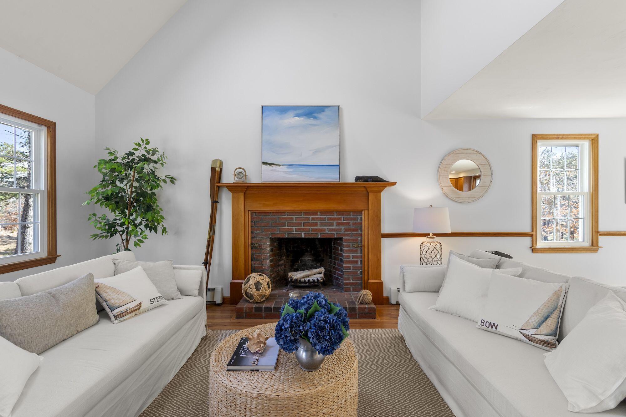 263 Spruce Road Harwich, MA 02645 - Photo 4 of 53 a living room with furniture and a fireplace