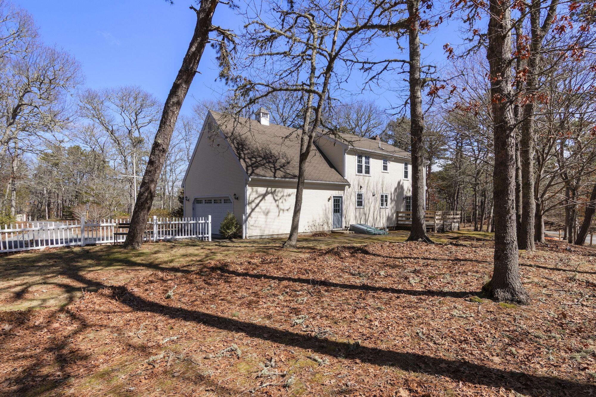 263 Spruce Road Harwich, MA 02645 - Photo 45 of 53 a view of a house with a yard