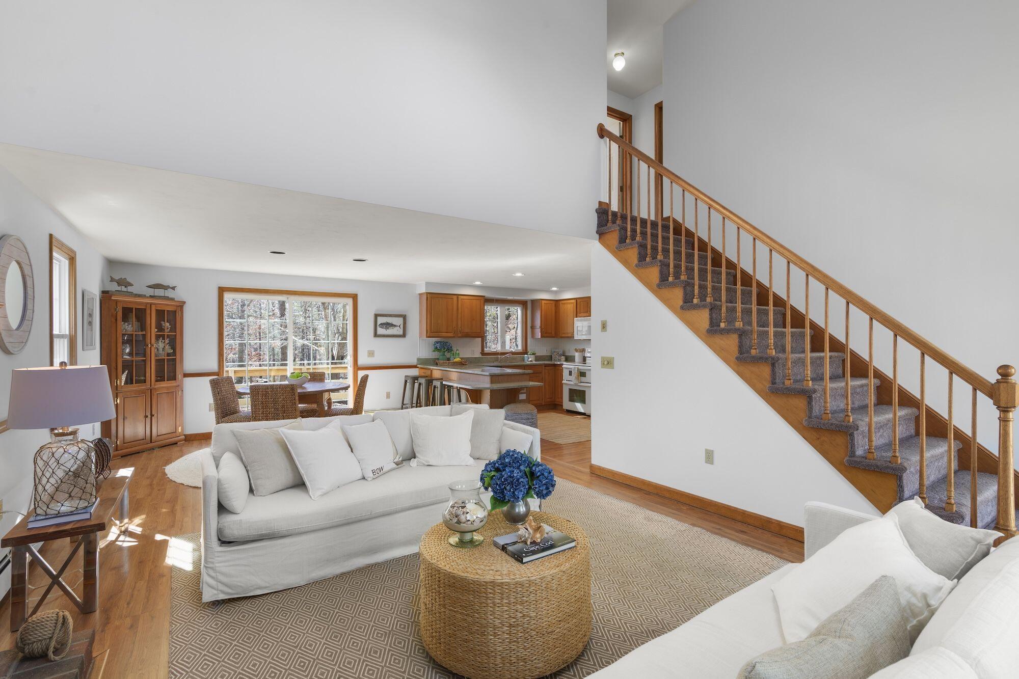 263 Spruce Road Harwich, MA 02645 - Photo 5 of 53 a living room with furniture and a dining table