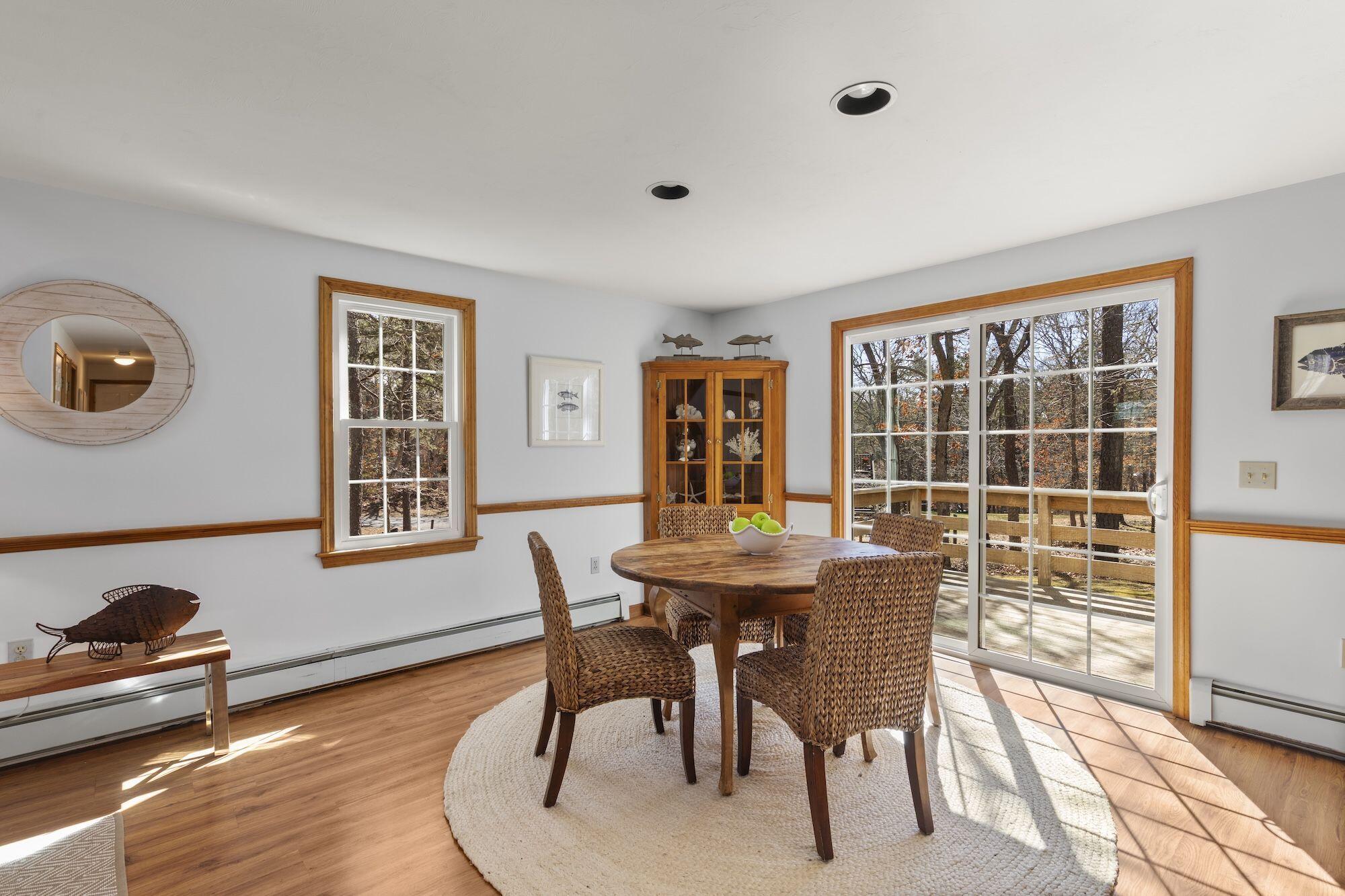 263 Spruce Road Harwich, MA 02645 - Photo 7 of 53 a view of a dining room with furniture and a window
