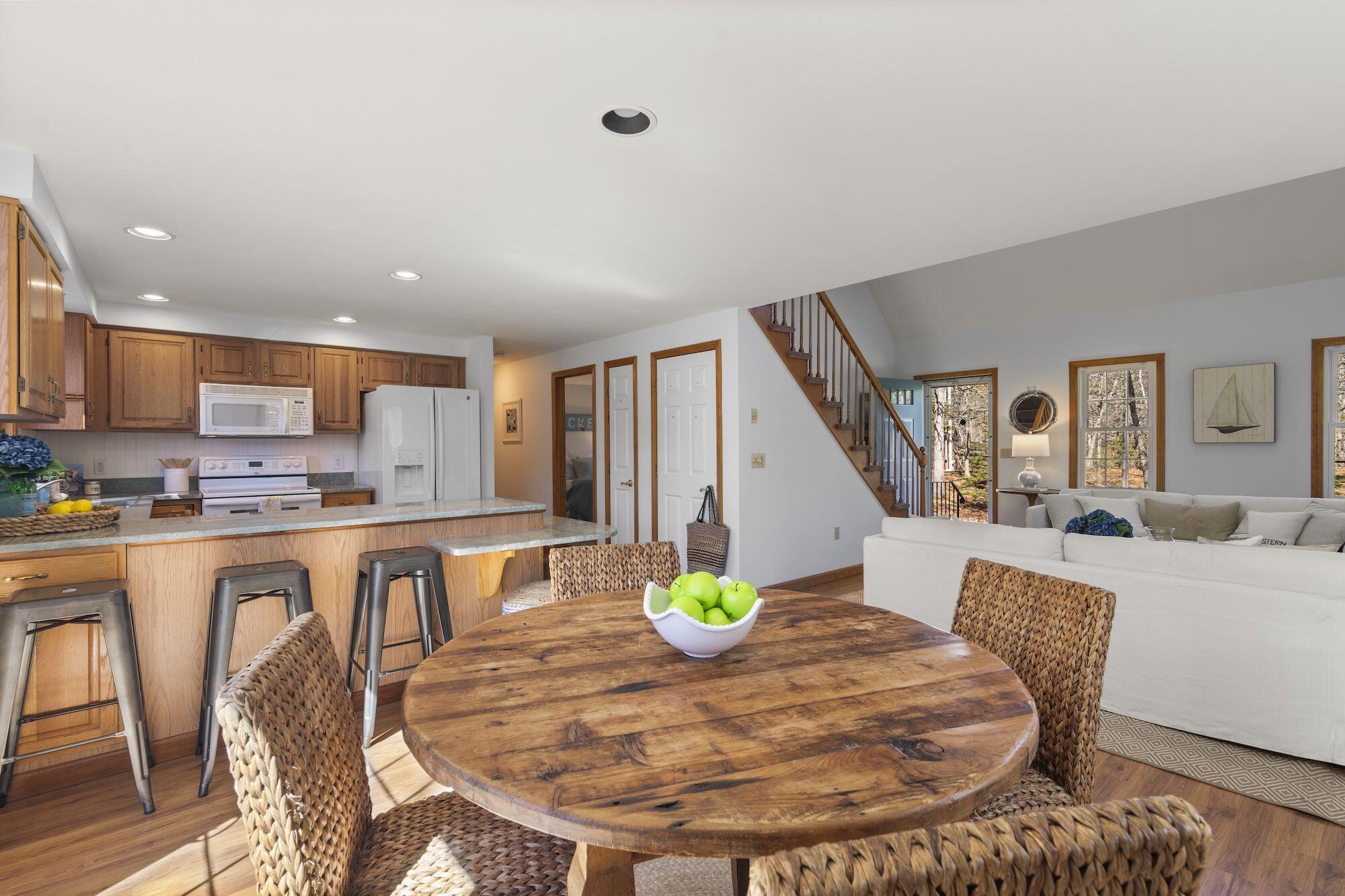 263 Spruce Road Harwich, MA 02645 - Photo 9 of 53 a living room with stainless steel appliances furniture a dining table and kitchen view