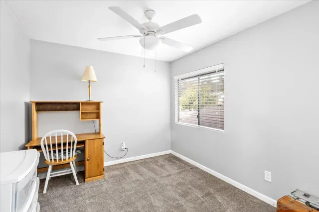 a workspace with furniture and a window